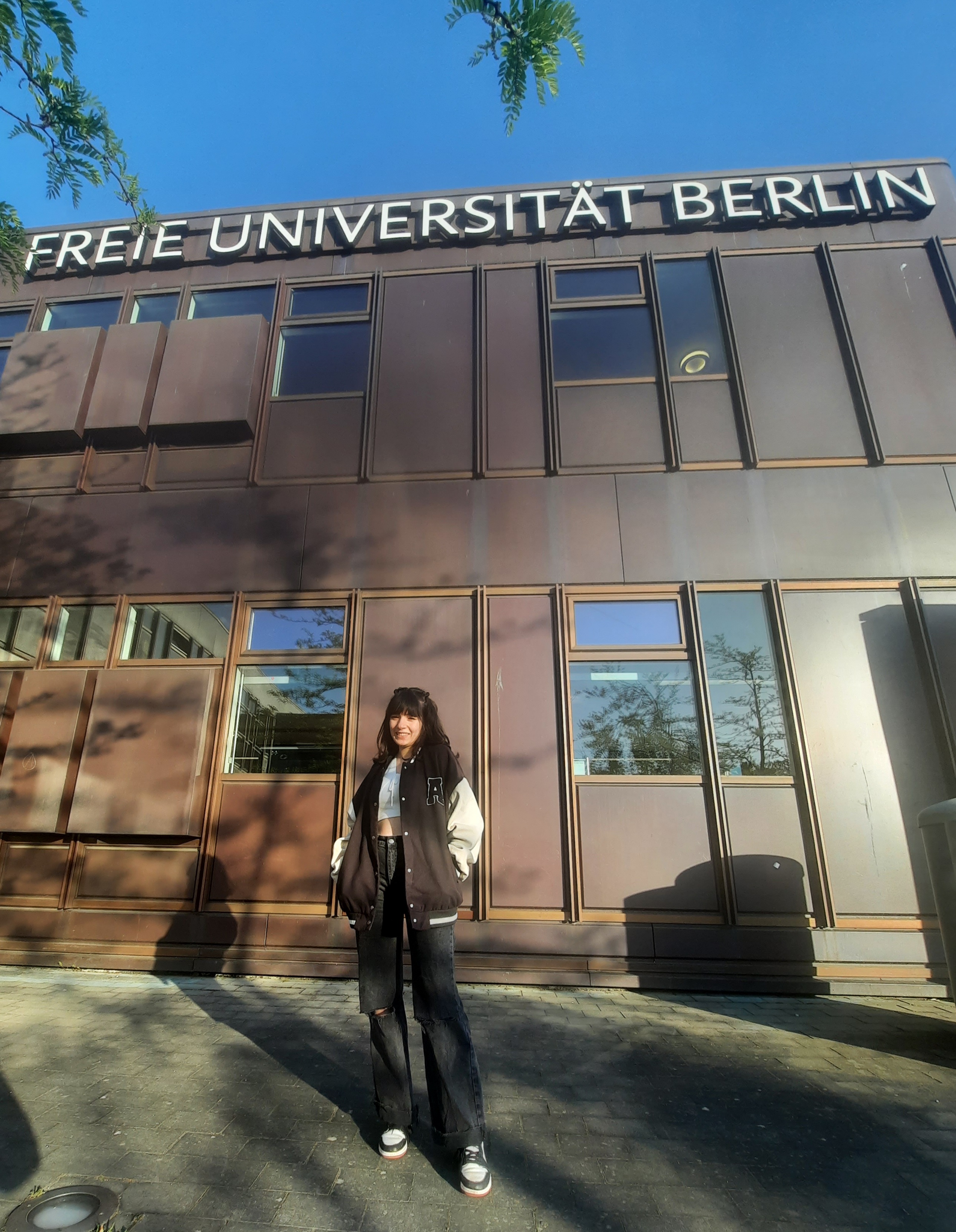 Lina Meghouche in front of the Freie Universität of Berlin